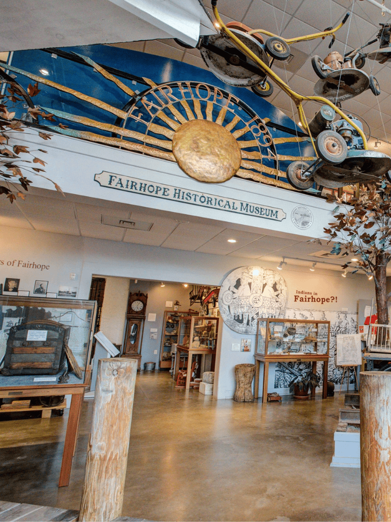 Old-fashioned aviation and historical artifacts at Fairhope Historical Museum for cultural exploration.