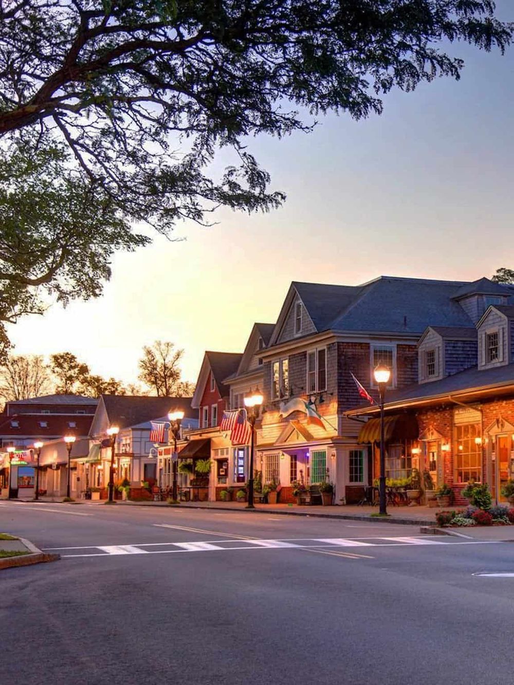 Charming downtown street with shops, cozy cafes, and vibrant atmosphere at sunset.