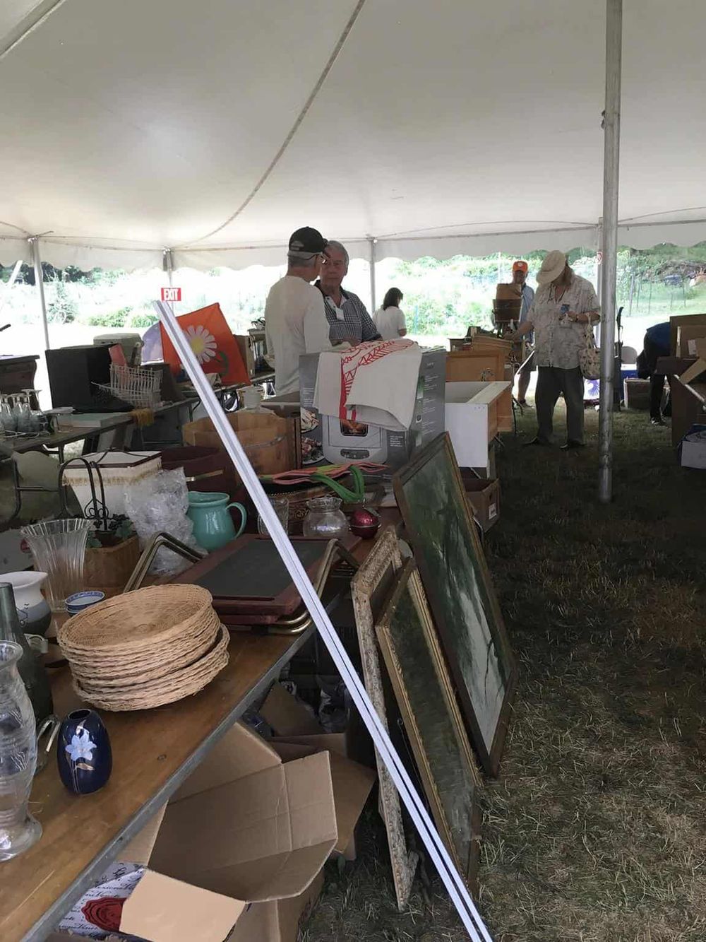 Vintage marketplace at QuestForDirections outdoor event, showcasing antiques and collectibles.