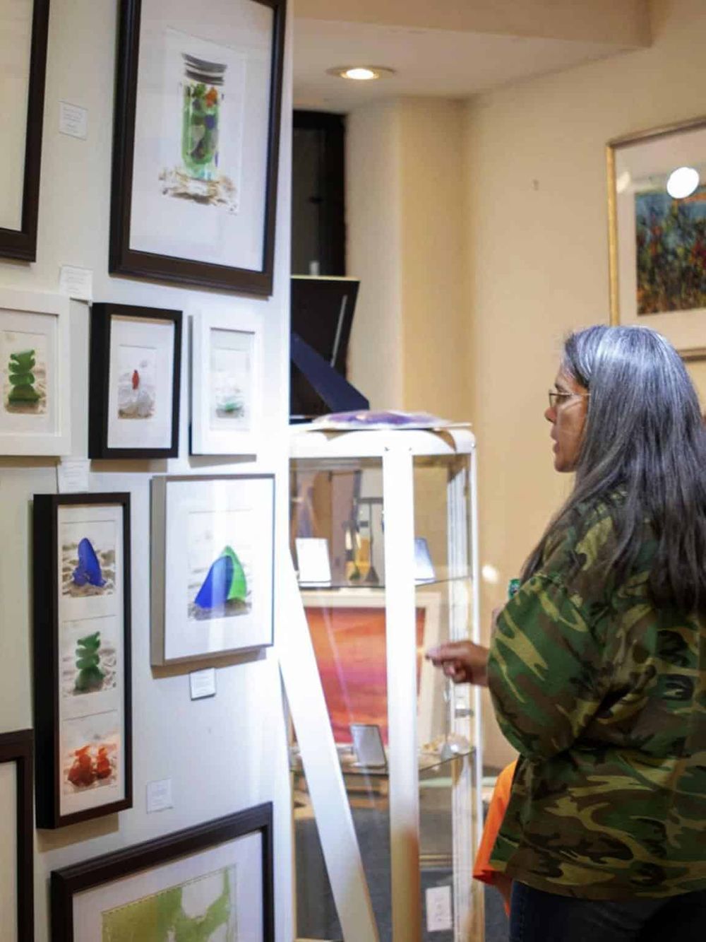 Colorful art gallery display at QuestForDirections art exhibit.