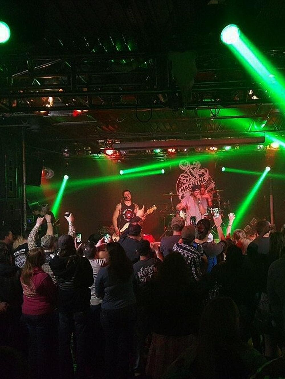 Live music concert with band performing and audience enjoying the show at QuestForDirections event.