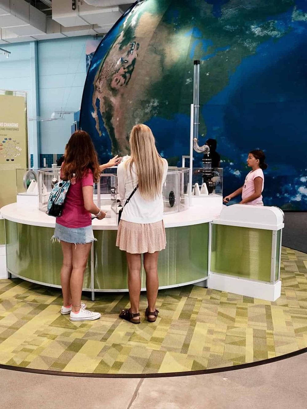 Interactive Earth globe exhibit for education and travel orientation at QuestForDirections.