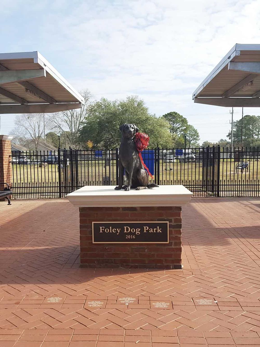 Dog park monument with dog statue at Foley Dog Park, 2016, outdoor community space.