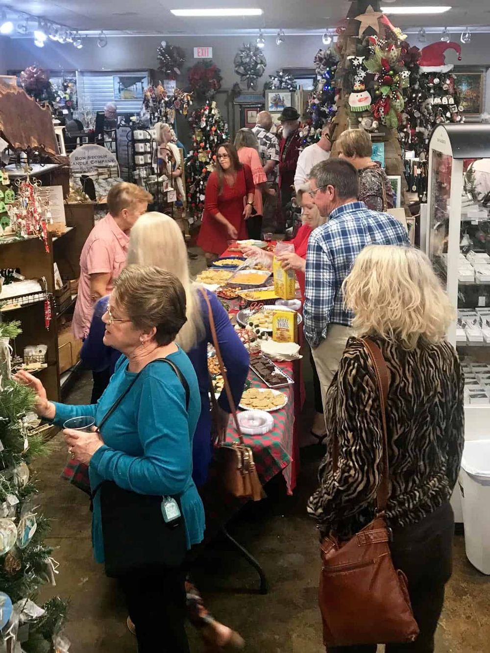 Festive Christmas shop filled with holiday decorations and shoppers browsing at QuestForDirections.