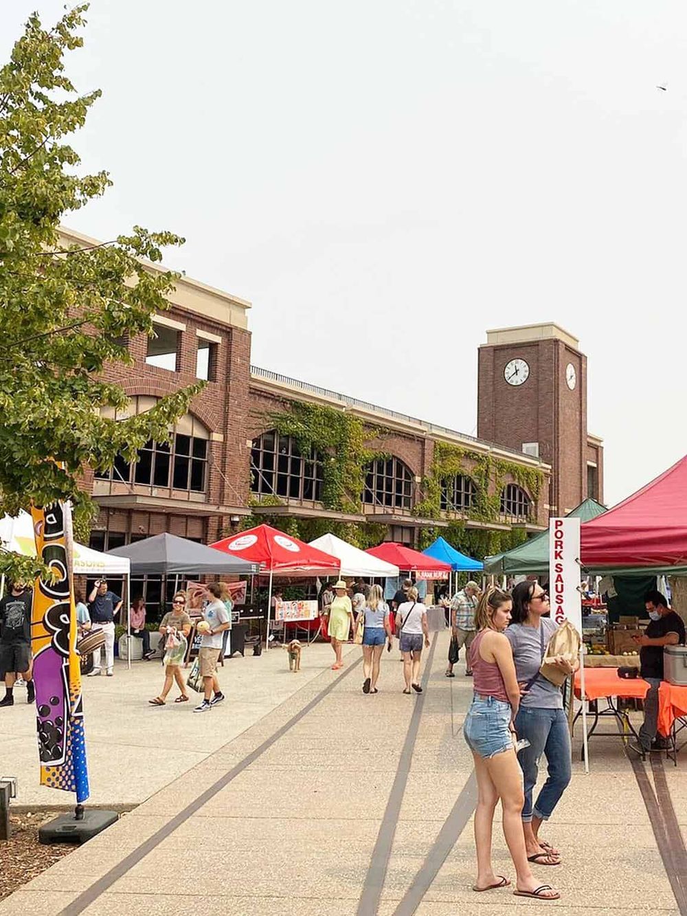 Bustling outdoor market at QuestForDirections urban shopping event.