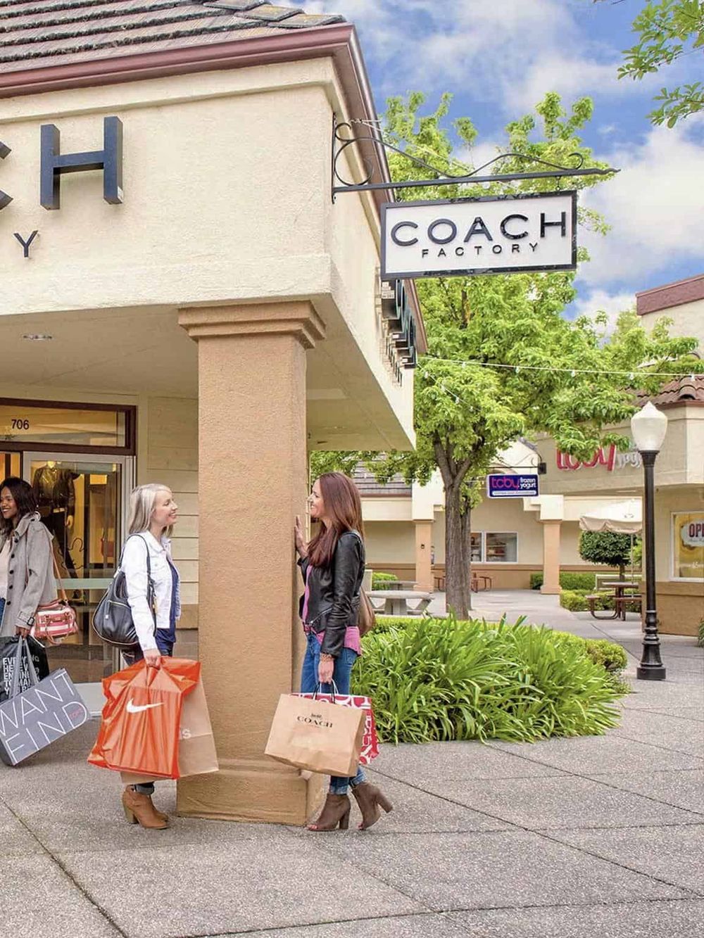 Chic retail shopping at Coach Factory store, popular for luxury handbags and accessories.