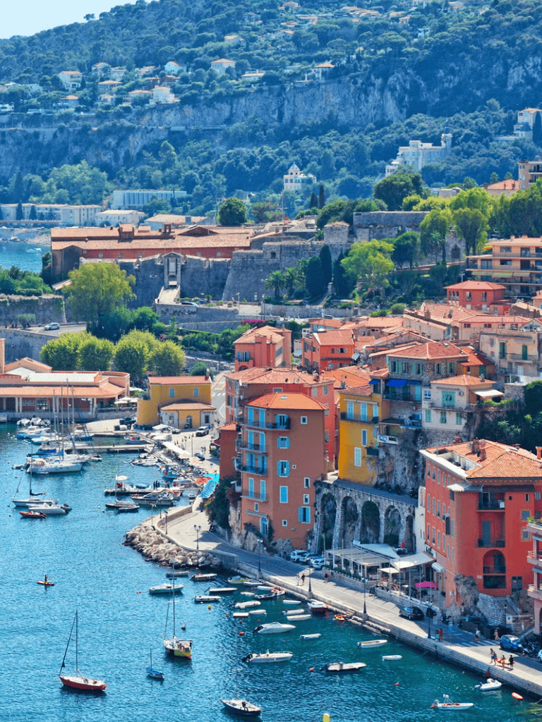 Stunning Mediterranean coastal town with colorful buildings and scenic harbor view.