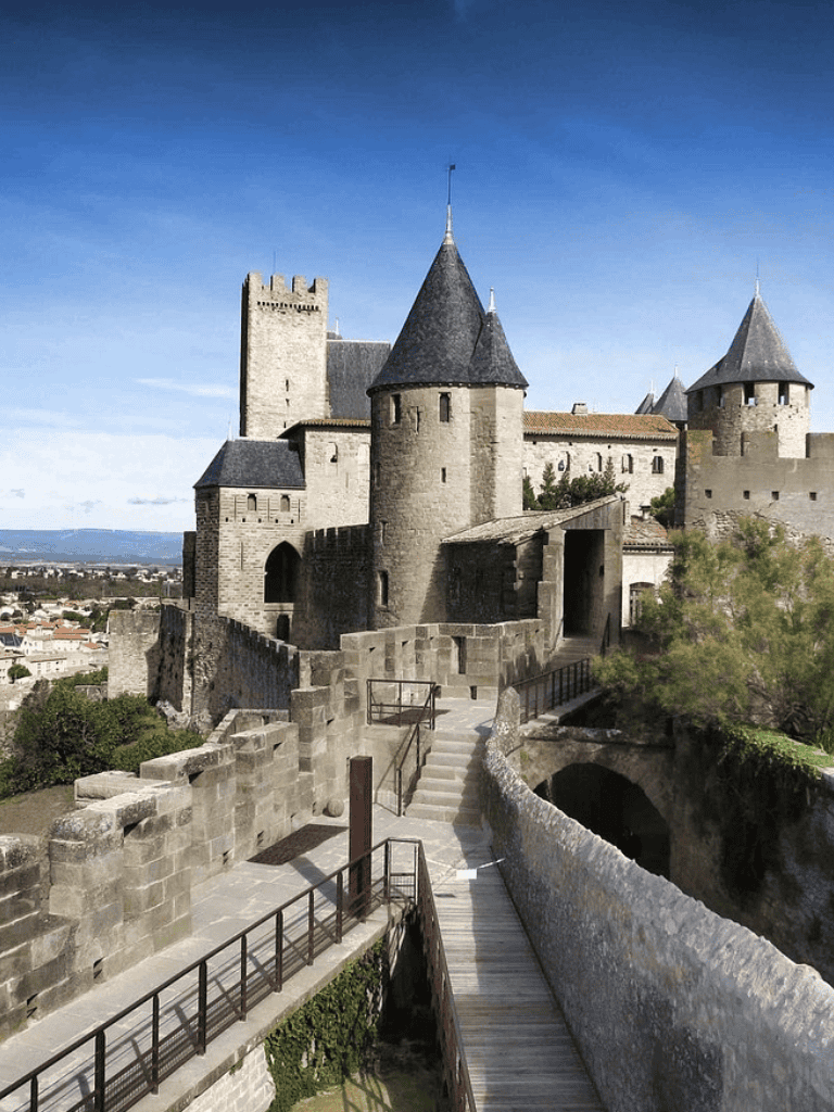 Ancient stone castle with towers and battlements, scenic view, fairytale architecture.