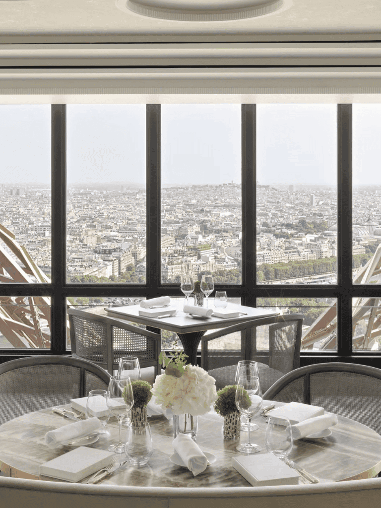 Luxurious restaurant table with Paris city view at QuestForDirections.