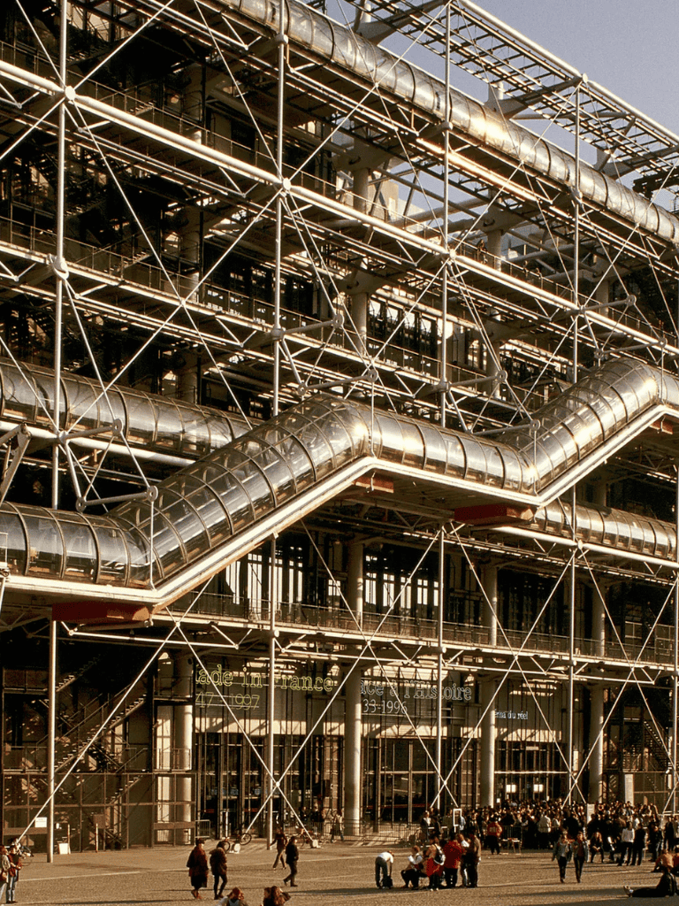 Industrial architecture with metal pipes and scaffolding, Paris exhibition center with visitors outside.