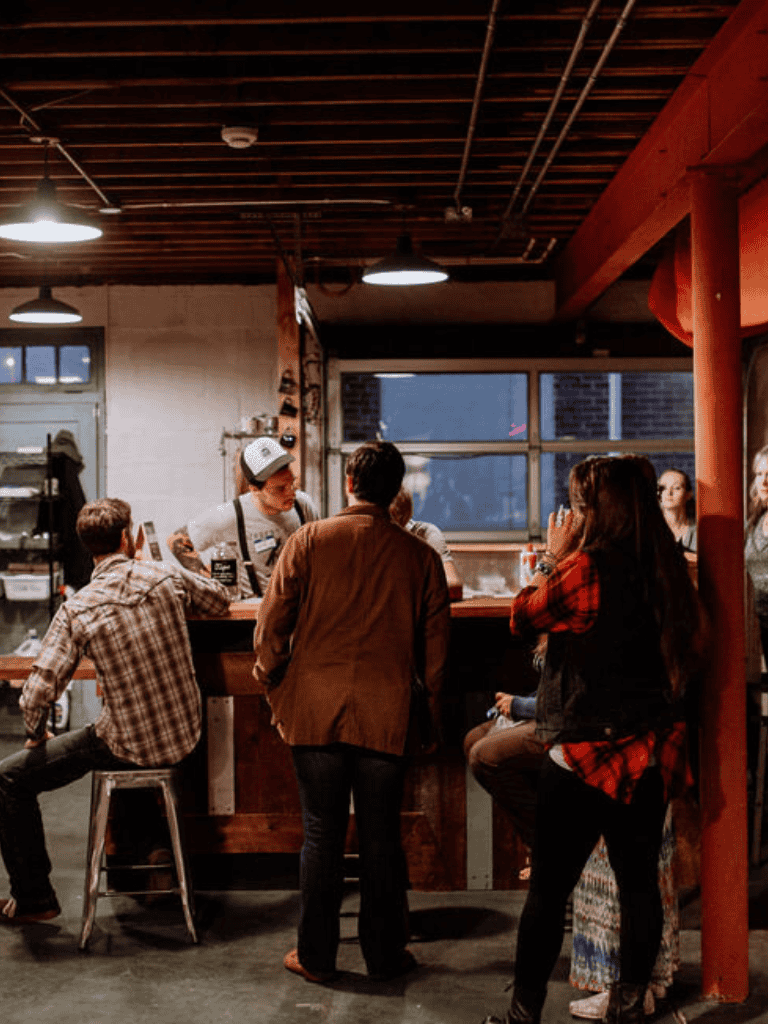 Commuter bar with friends, warm requested and gas, night scene.