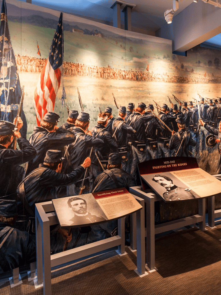 Soldiers marching during the Civil War exhibit at QuestForDirections, illustrating battle history and military strategy.