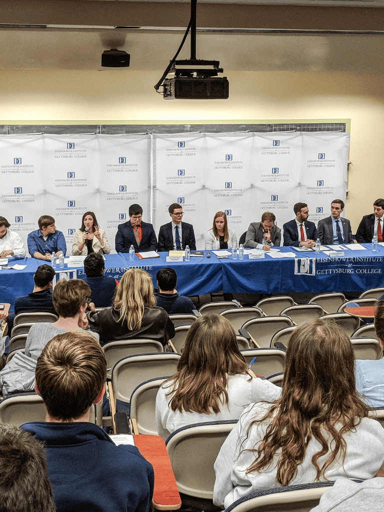 Expert student debate at Gettysburg College event focused on leadership and academic excellence.
