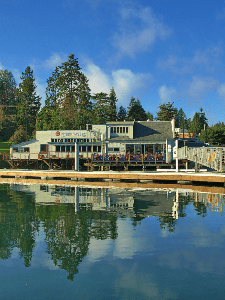 Quaint lakeside restaurant with outdoor deck and scenic water views.