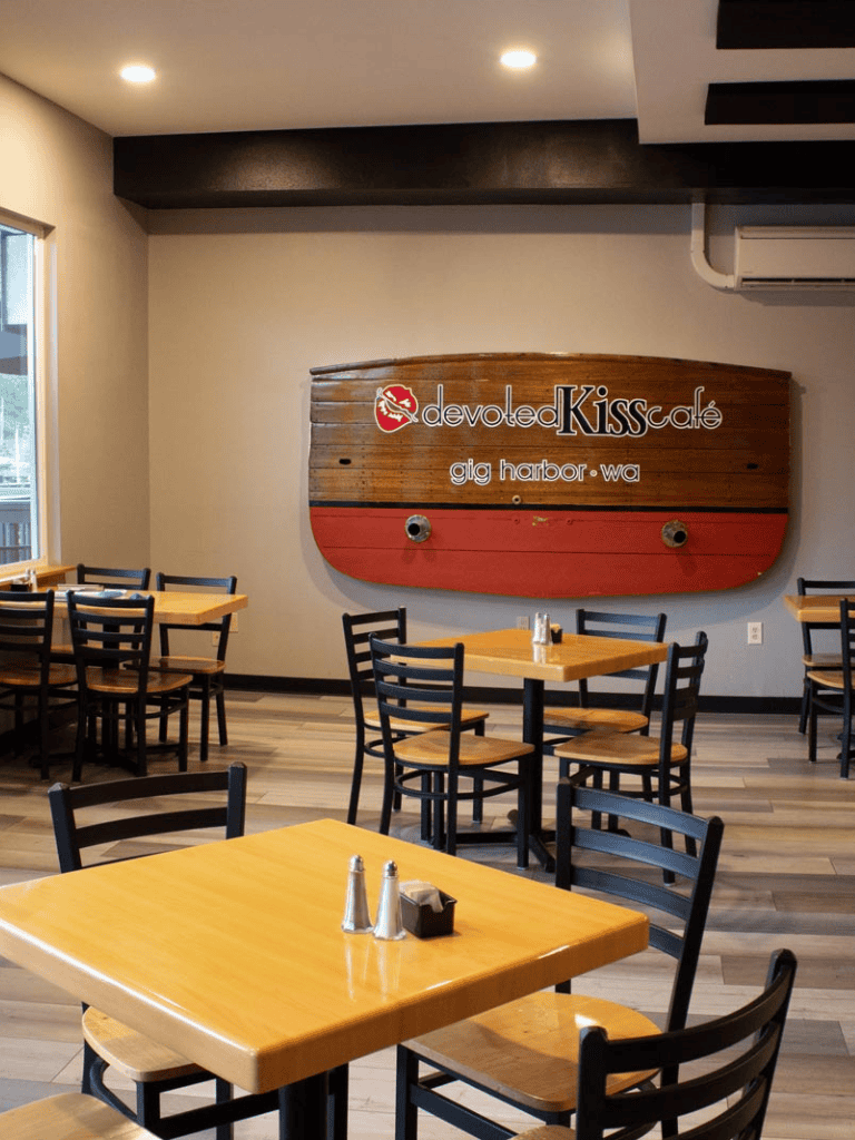 Devoted Kiss cafe Gig Harbor WA dining area with wooden tables and nautical decor.