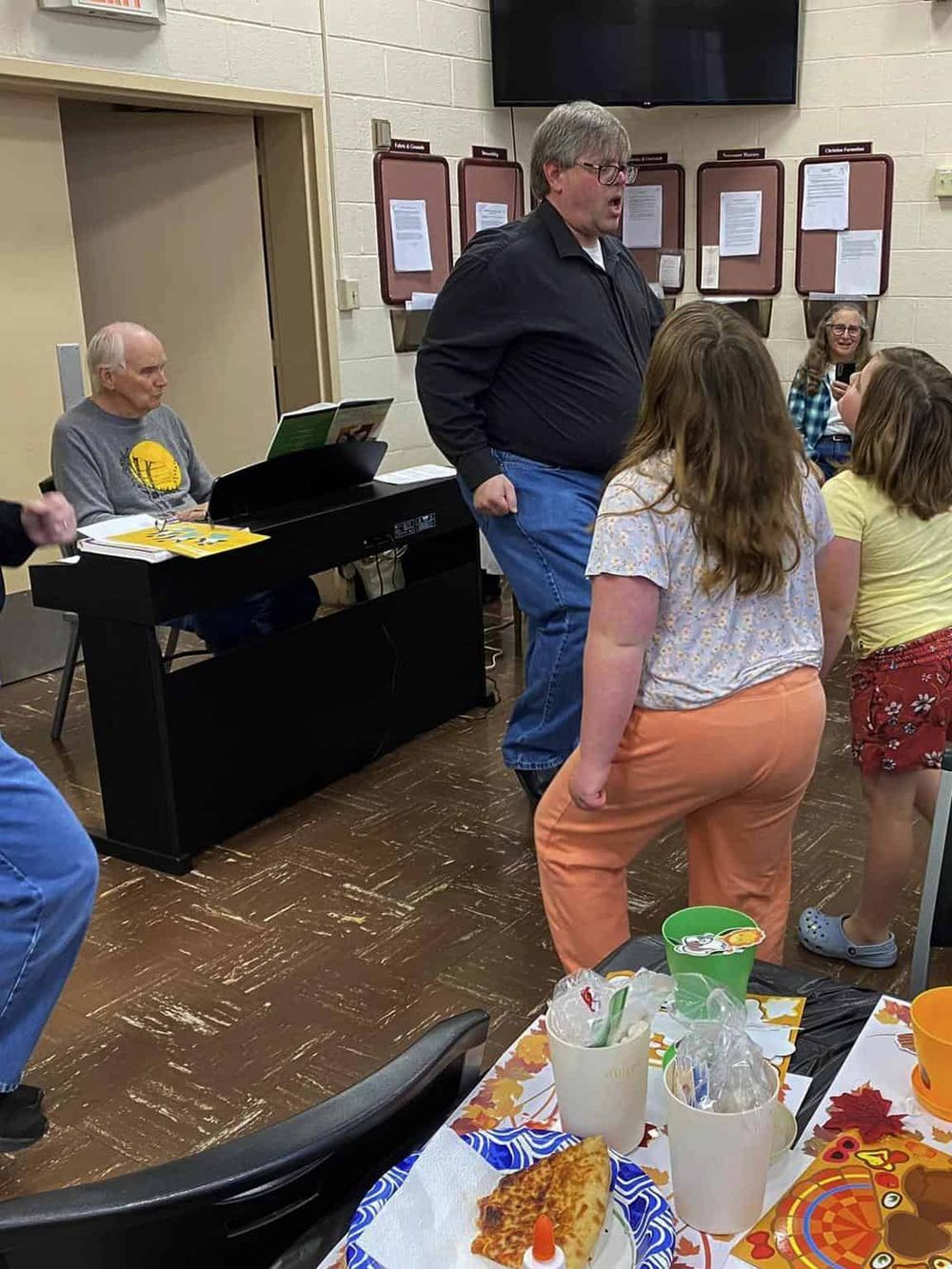 1. People engaging in a musical activity at a community event.