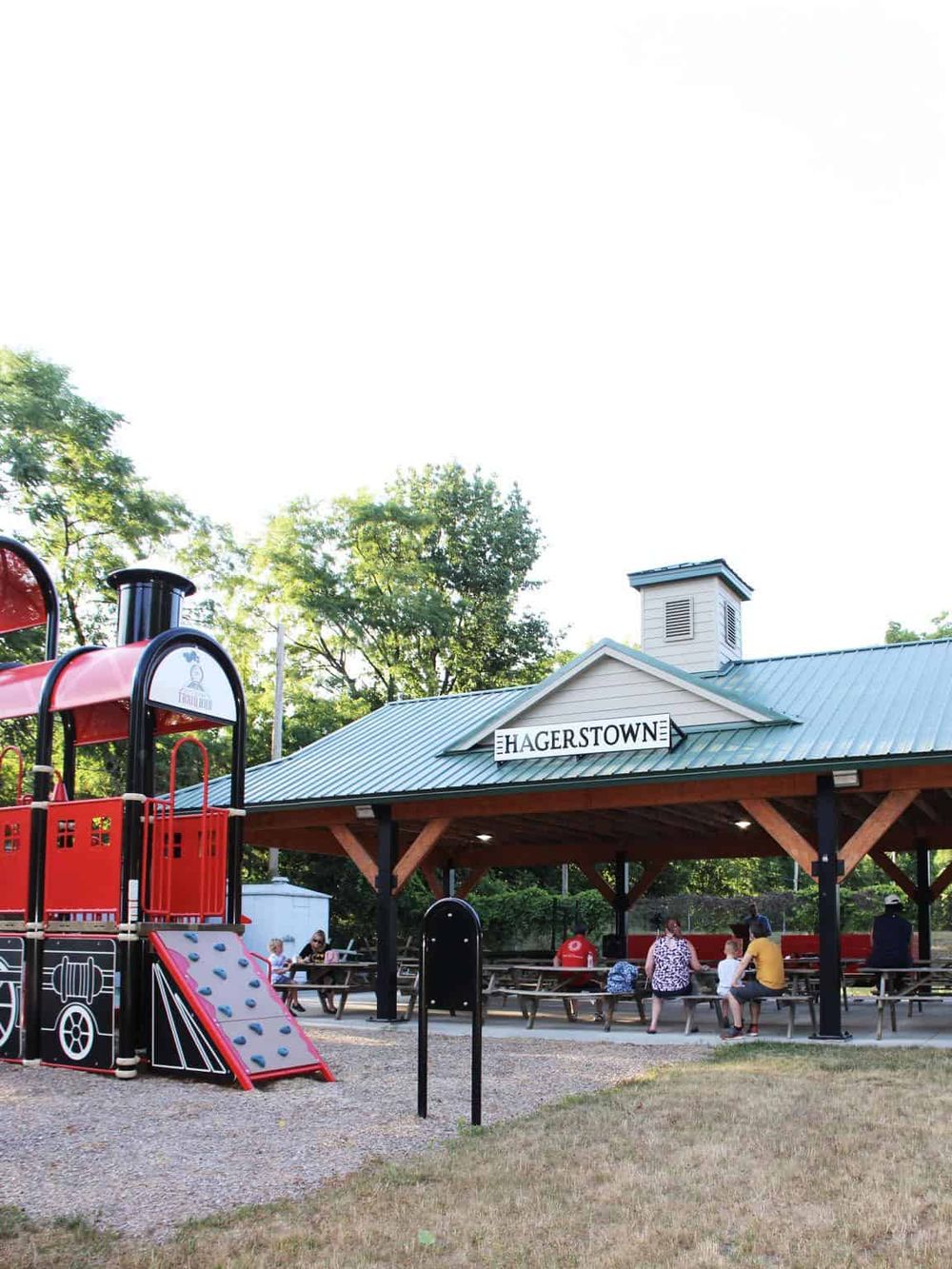 Playground and pavilion at Hagerstown park with families and children.