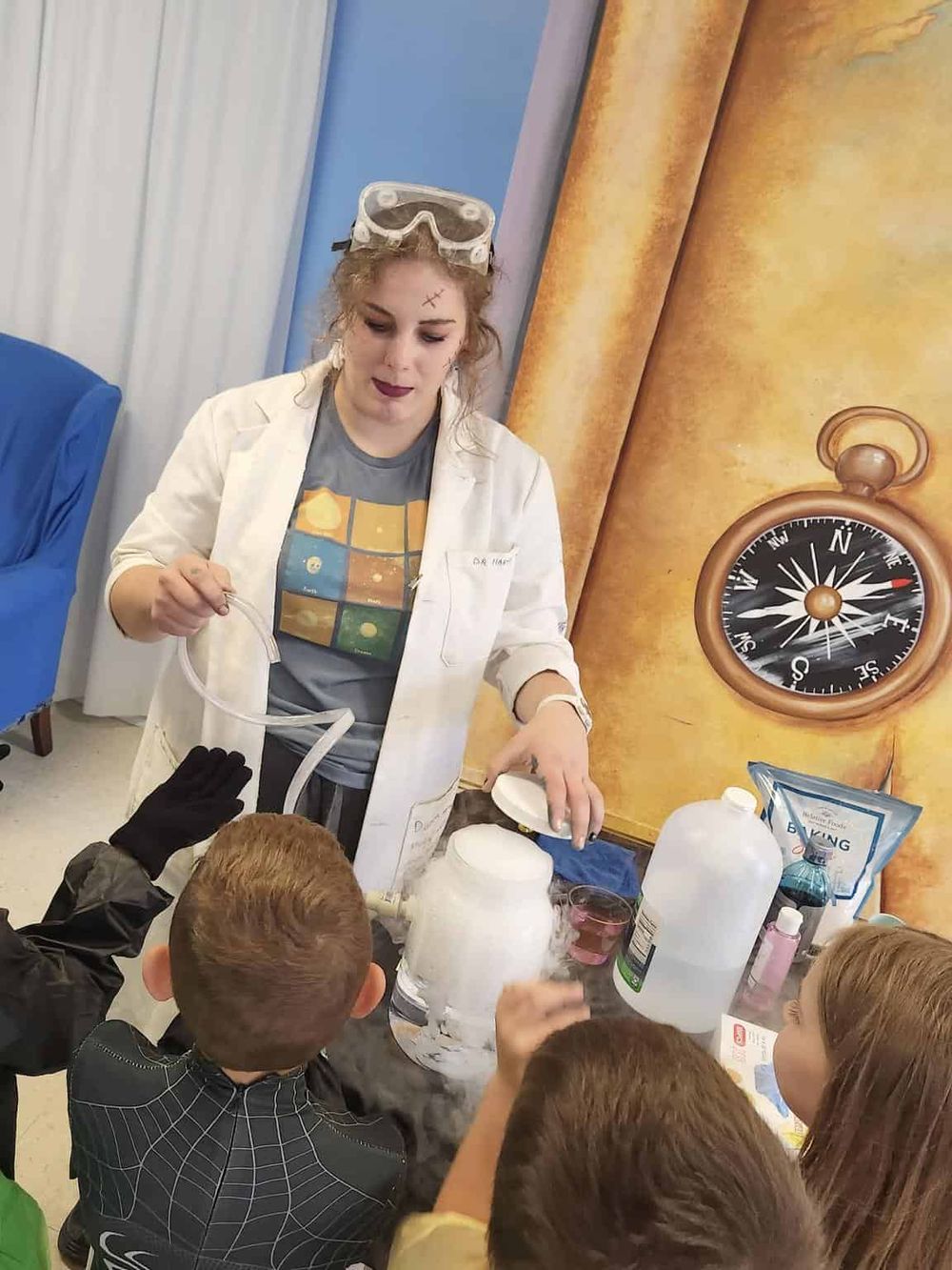 Dry ice science demonstration for kids at QuestForDirections educational event.