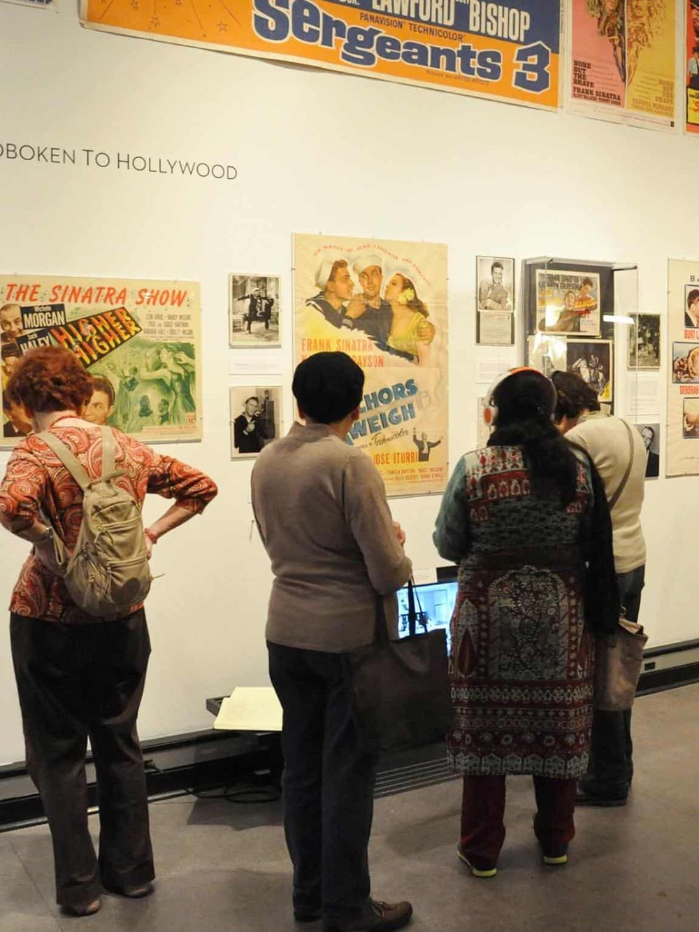 Vintage Hollywood film posters display at a museum exhibit.