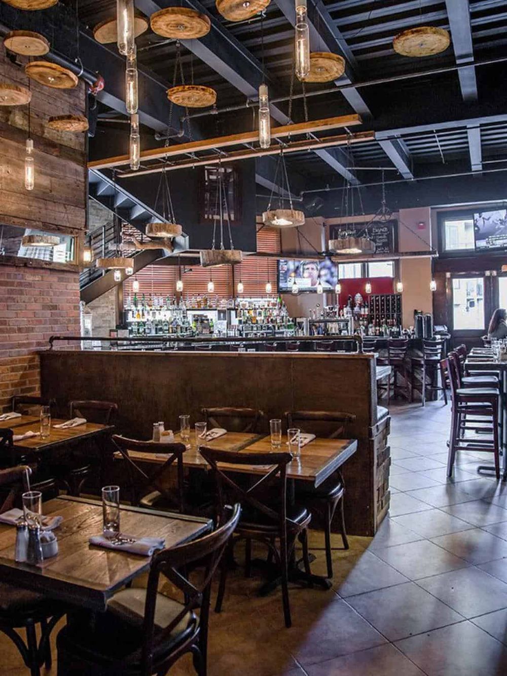 Cozy restaurant interior with rustic wood accents and ambient lighting, ideal for dining experiences.