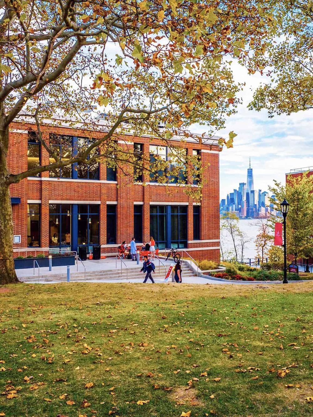Beautiful autumn scene at QuestForDirections building with NYC skyline in background.