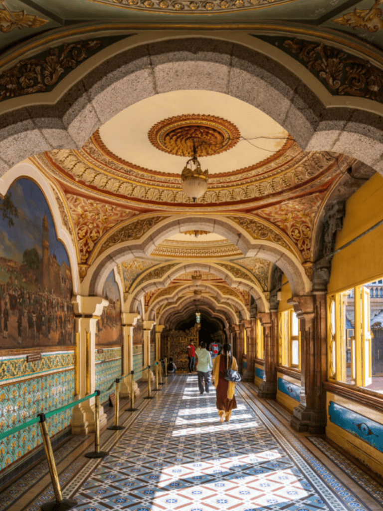 Elegant ornate Asian palace corridor with intricate ceiling designs and vibrant colors.