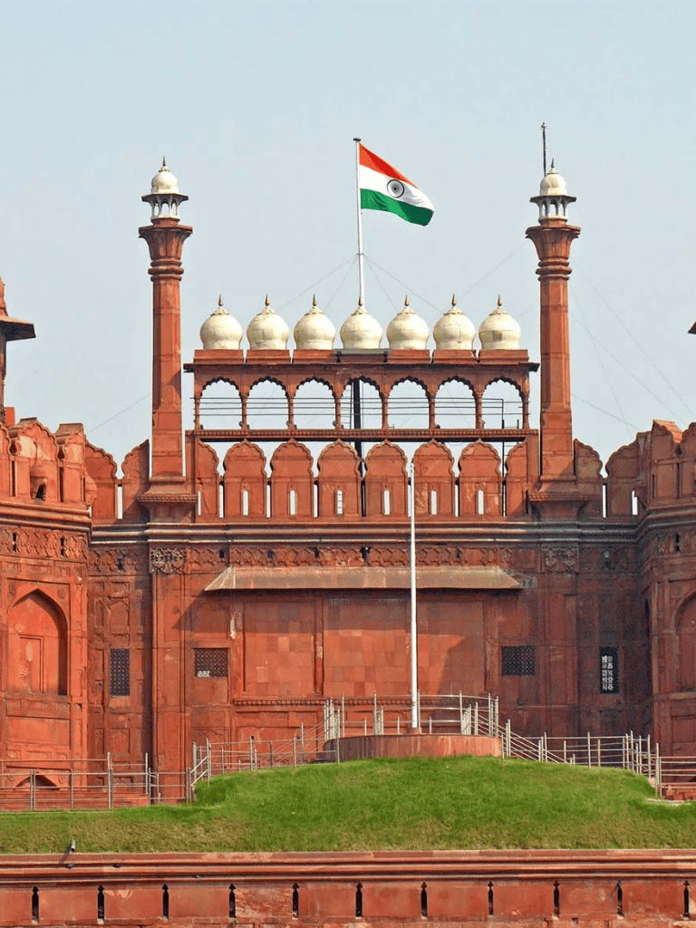 India national flag on red sandstone historical monument, prominent Indian heritage site, famous for its architecture and cultural significance, part of QuestForDirections.
