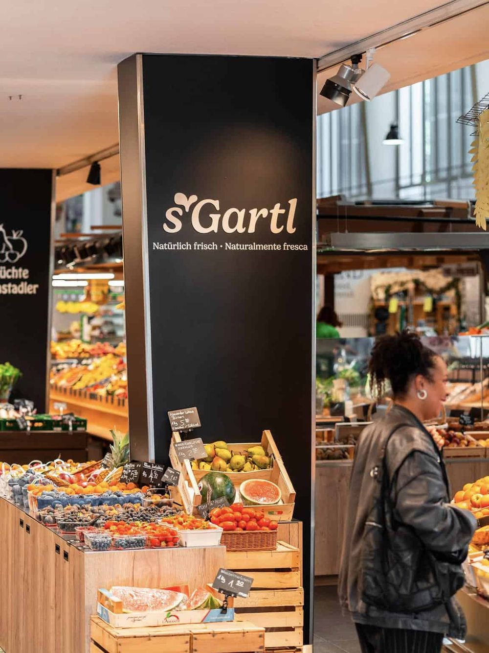 Colorful fresh fruits display at local market in Germany, accommodating diverse health-conscious shoppers.