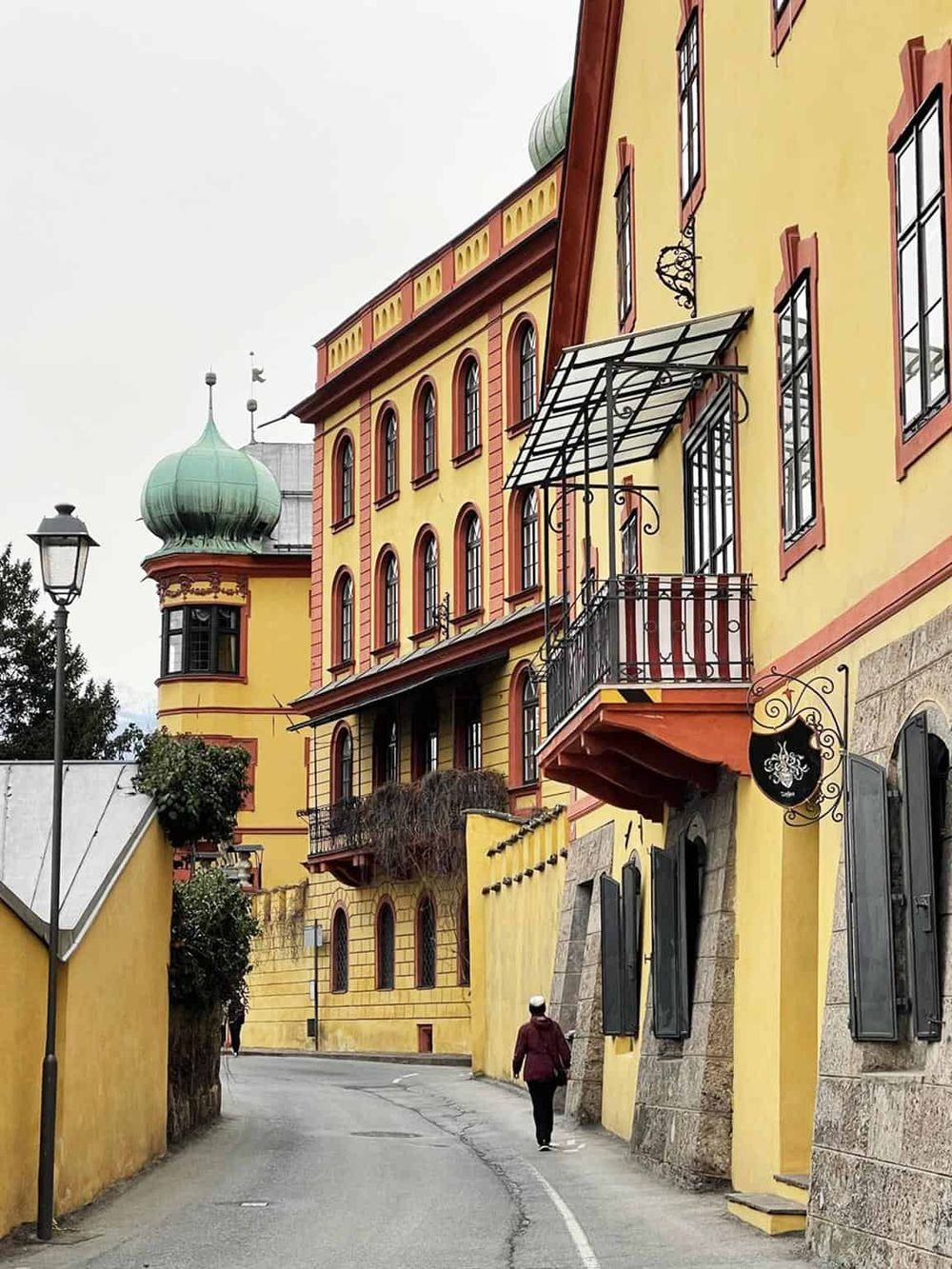 Colorful European street scene with historic architecture and charming balconies, perfect for travel and cultural exploration.
