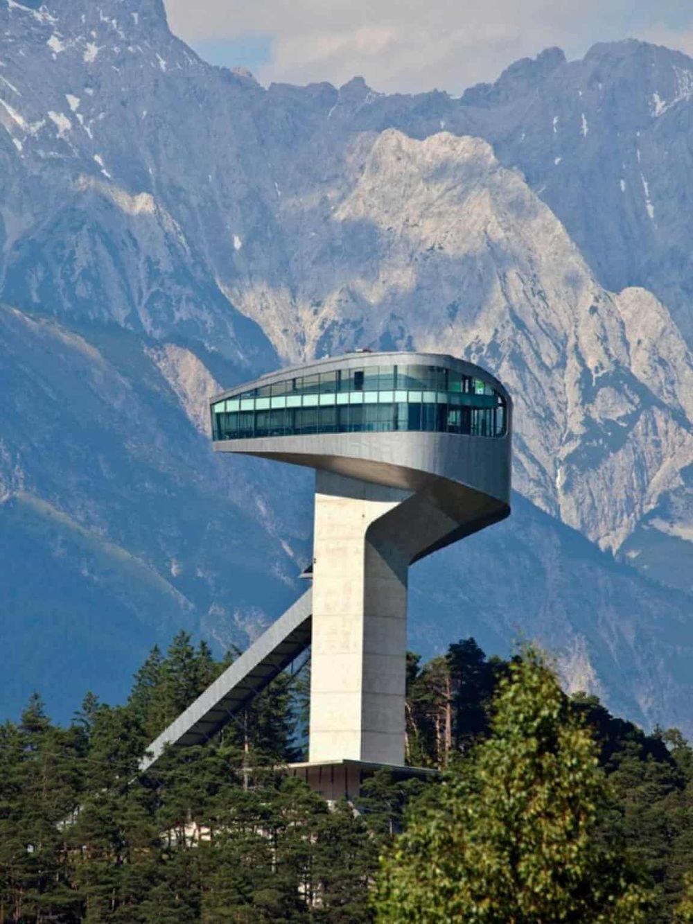 Modern observation tower amidst mountain landscape for outdoor exploration and scenic views.