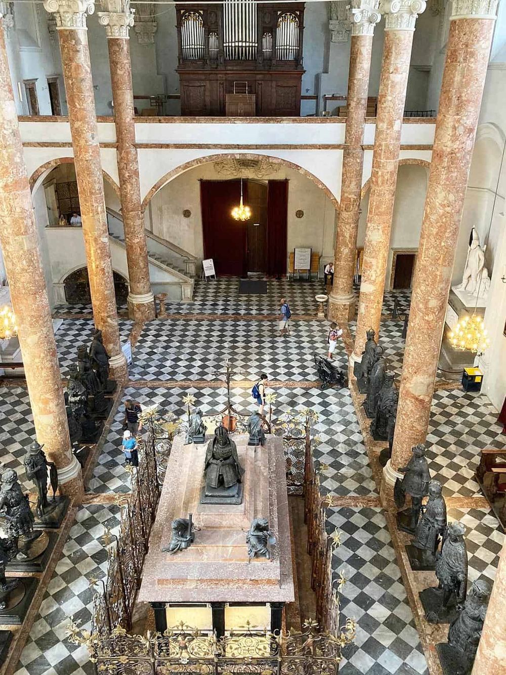 Intricate marble columns and historical statues highlight the grandeur of the Quest for Directions museum lobby.