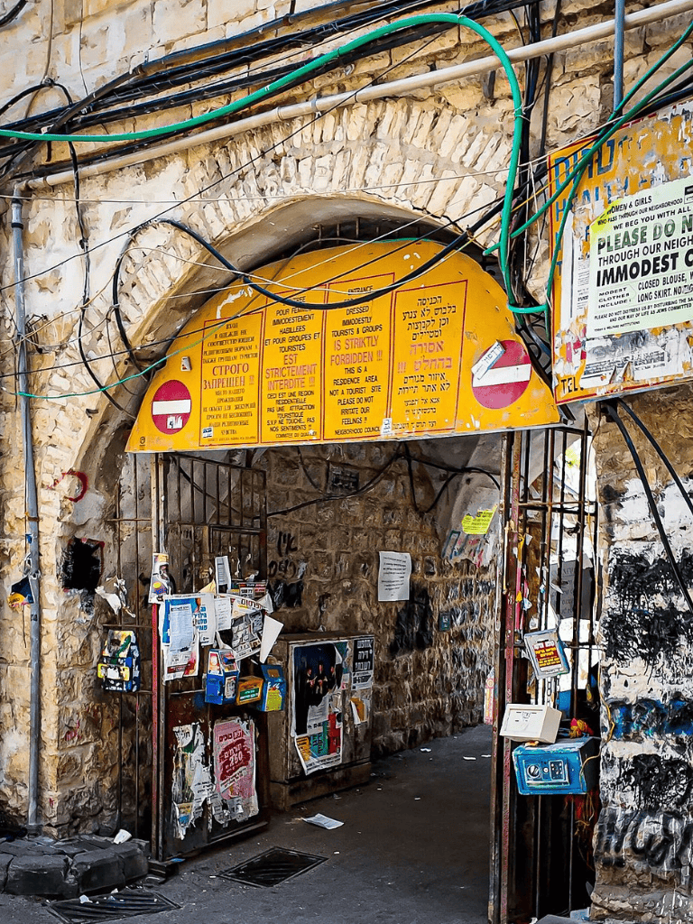 No entry, restricted area, Jerusalem ancient city walls, travel restrictions, official signs, urban street scene, safety zone.