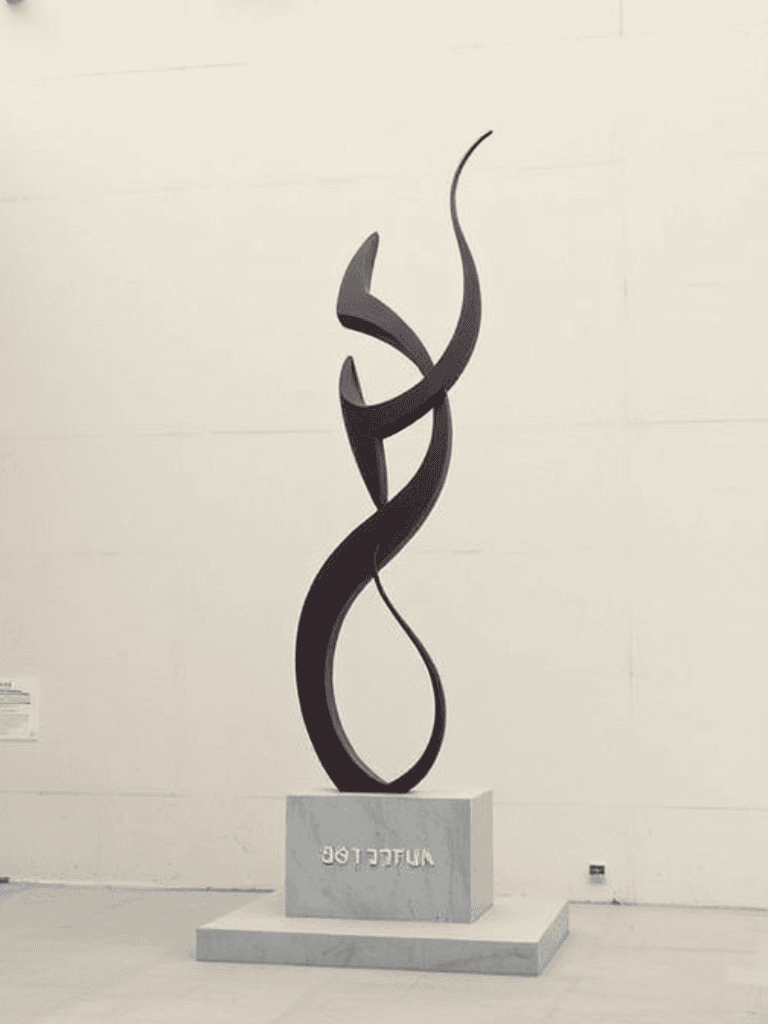 Modern abstract sculpture representing innovation and creativity, ideal for corporate or gallery display.