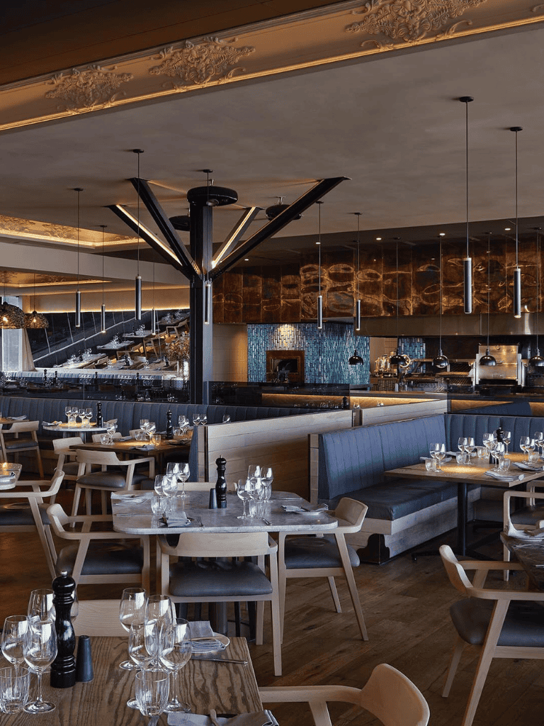 Elegant modern restaurant interior with stylish lighting and sophisticated decor | QuestForDirections.