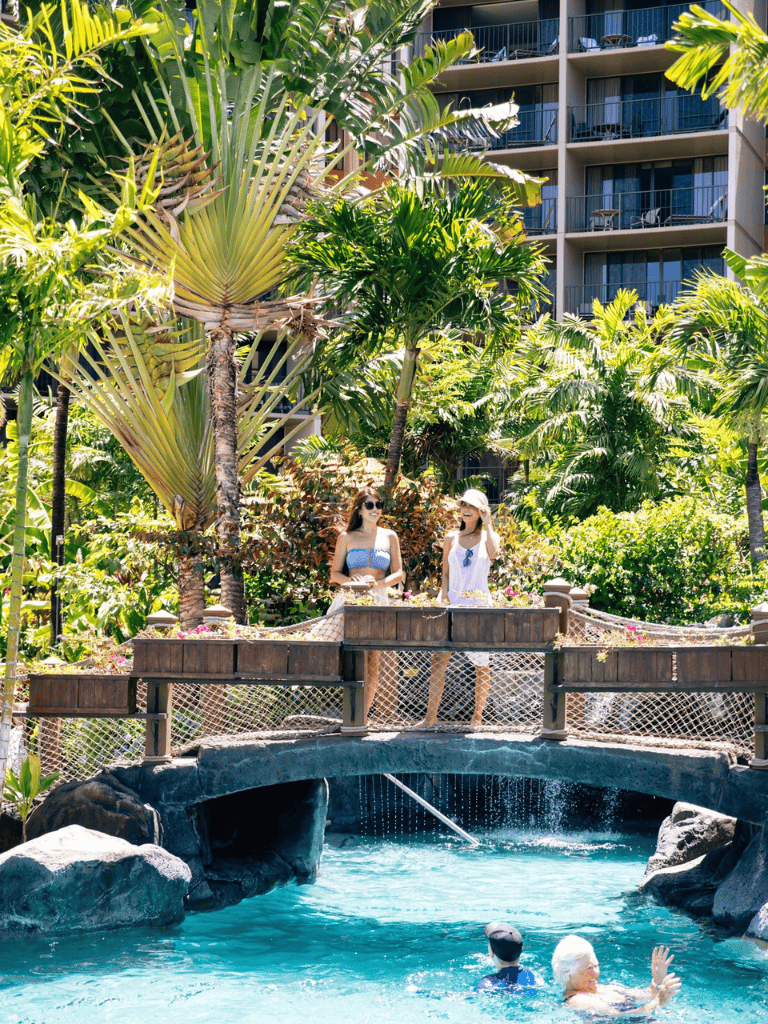 Relaxing tropical poolside scene at QuestForDirections hotel resort in vibrant greenery and modern accommodations.
