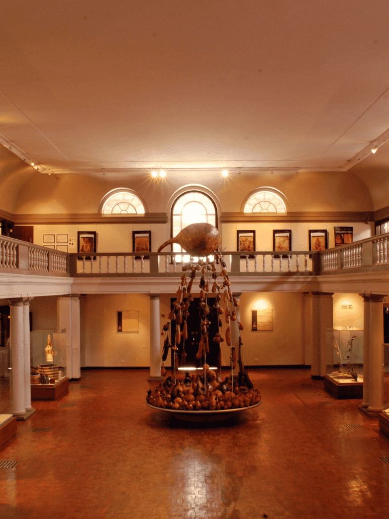 Ancient artifact exhibit in historic museum interior, showcasing cultural history and preserved relics.