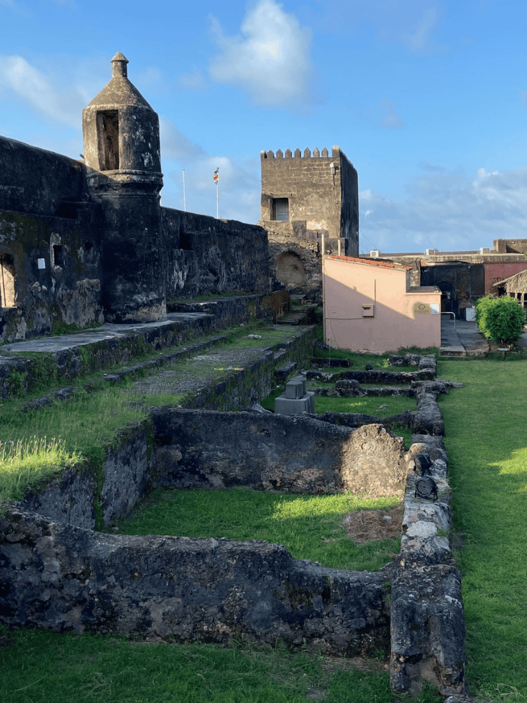 Ancient fortress with stone walls and towers in a historic Caribbean site.