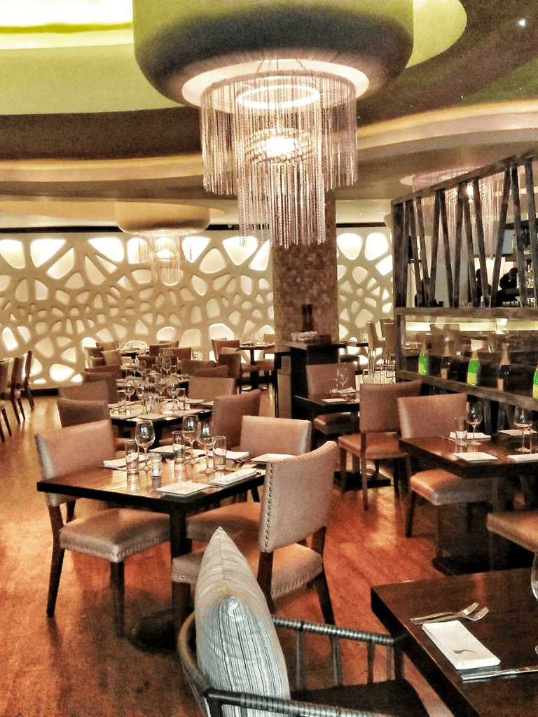 Elegant upscale restaurant interior with modern decor and ambient lighting for fine dining.
