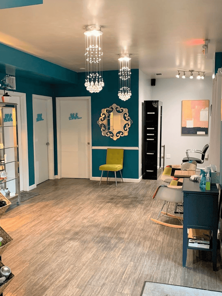 Elegant interior design of a modern wellness or beauty studio with stylish lighting and decor.