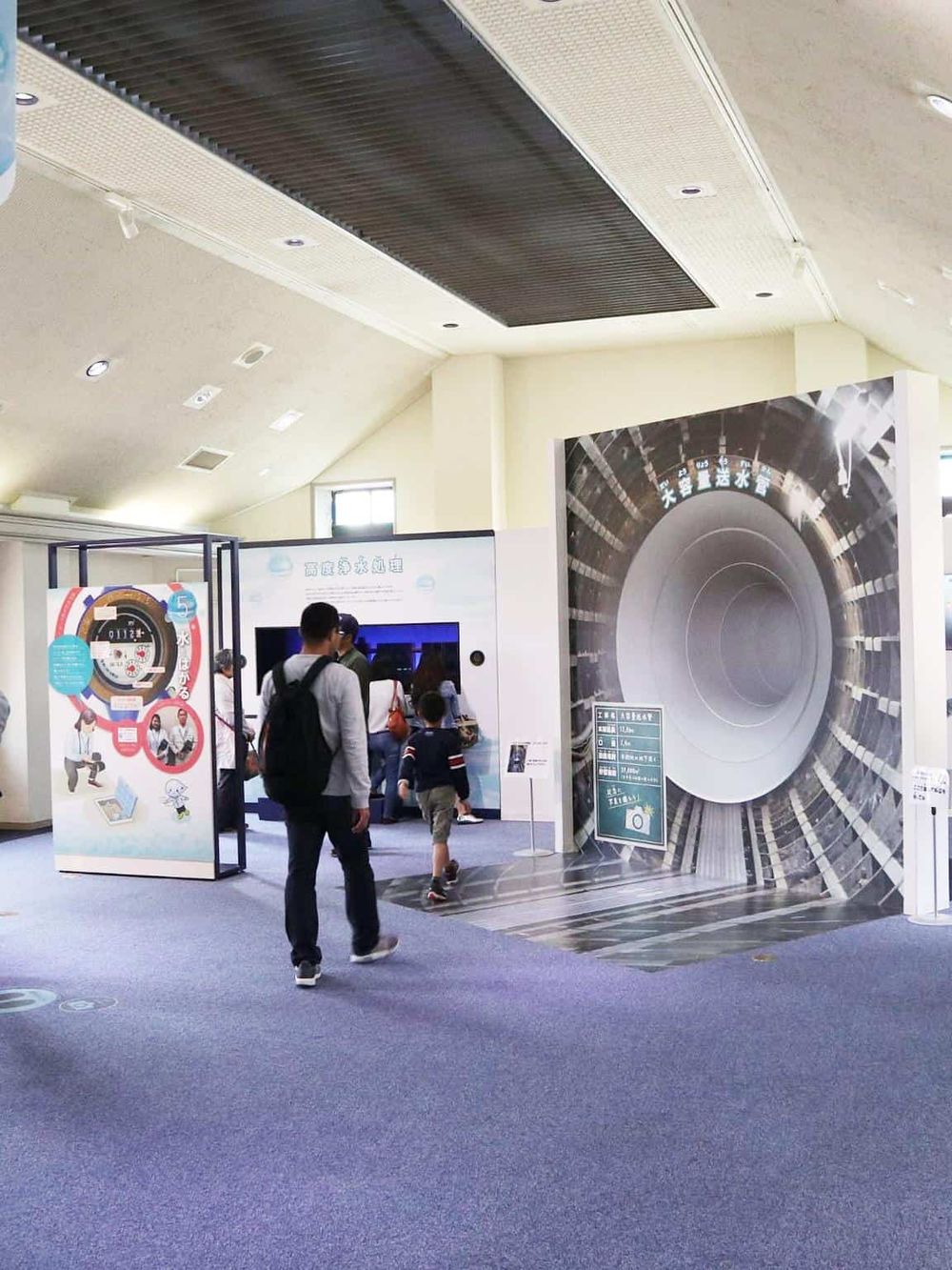 Interactive space with digital exhibits and directional guides at QuestForDirections.