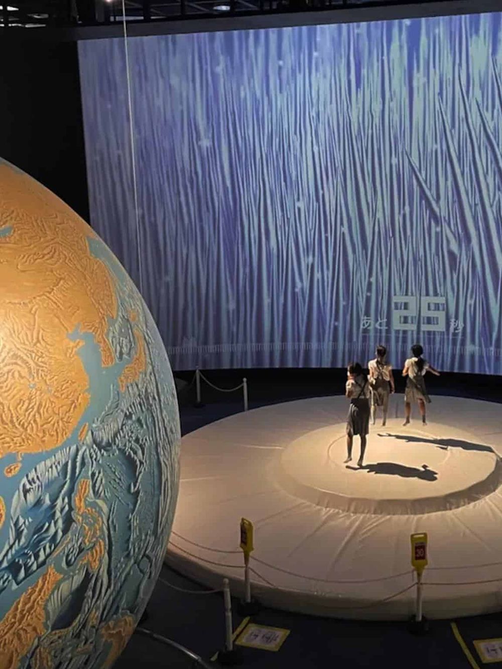 Earth globe and immersive earth science exhibit at QuestForDirections museum.