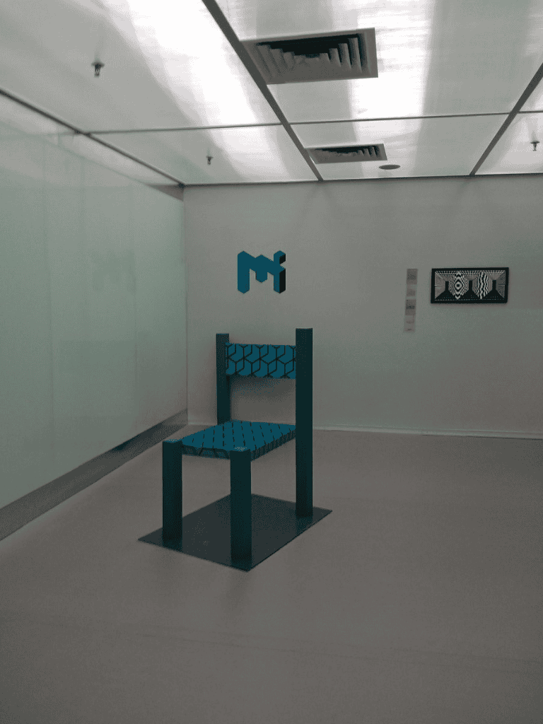 Elevator waiting area with modern decor at QuestForDirections office.