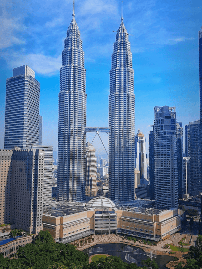 Petronas Towers Kuala Lumpur, Malaysia, iconic skyscrapers, modern city, sightseeing, architecture, Travel destinations, QuestForDirections.