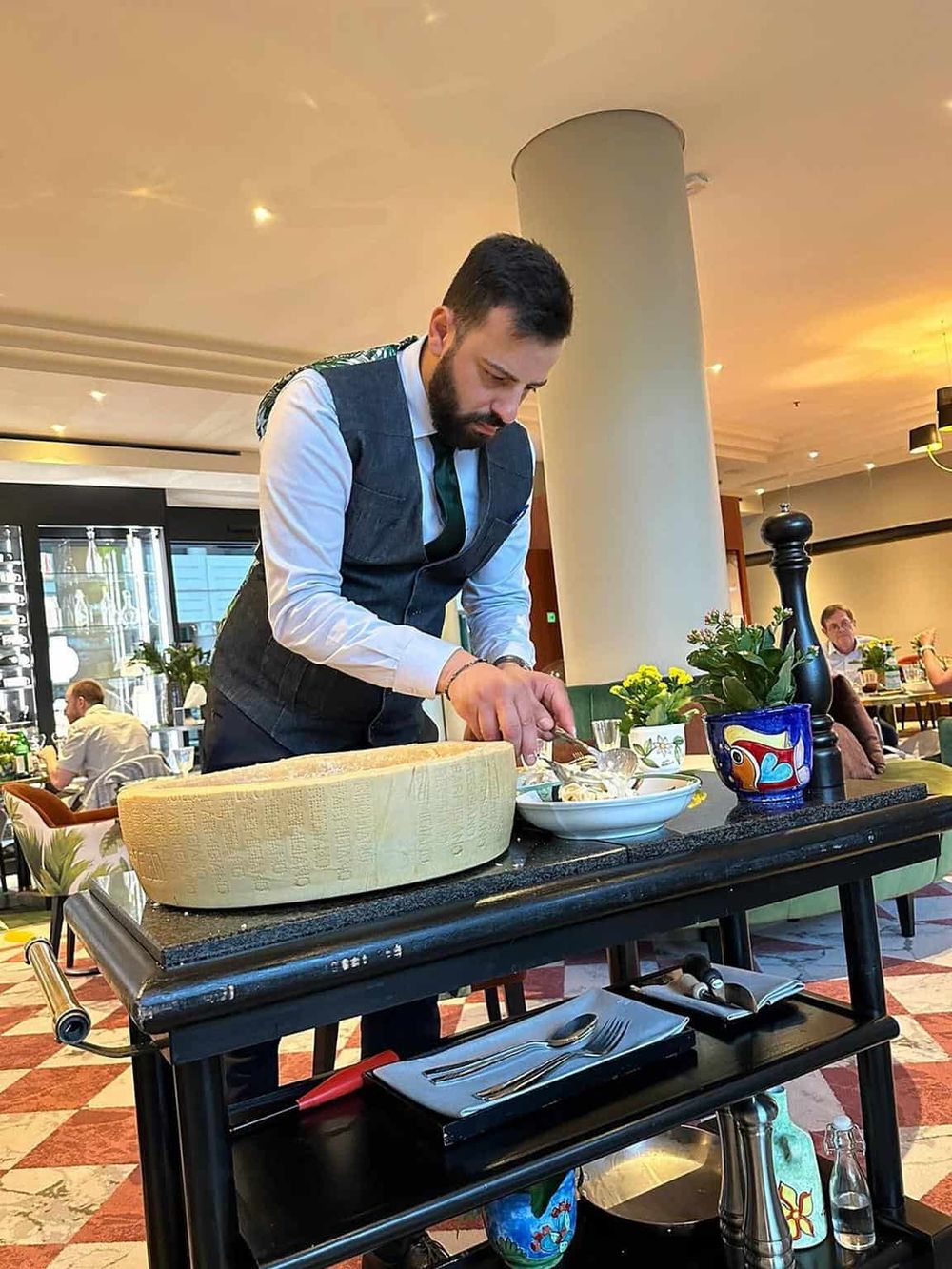 1. Professional chef preparing pasta in restaurant, gourmet Italian cuisine, culinary expertise, fine dining atmosphere.