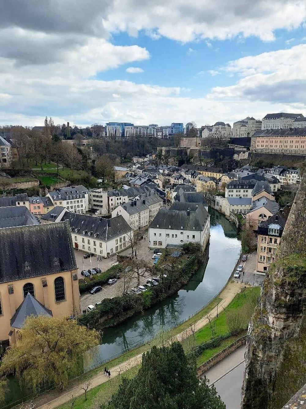 Charming cityscape view of Luxembourg from a high vantage point, showcasing historic buildings and the river.