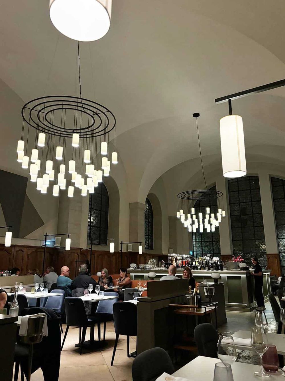 Elegant modern restaurant interior with stylish lighting and dining for international cuisine.