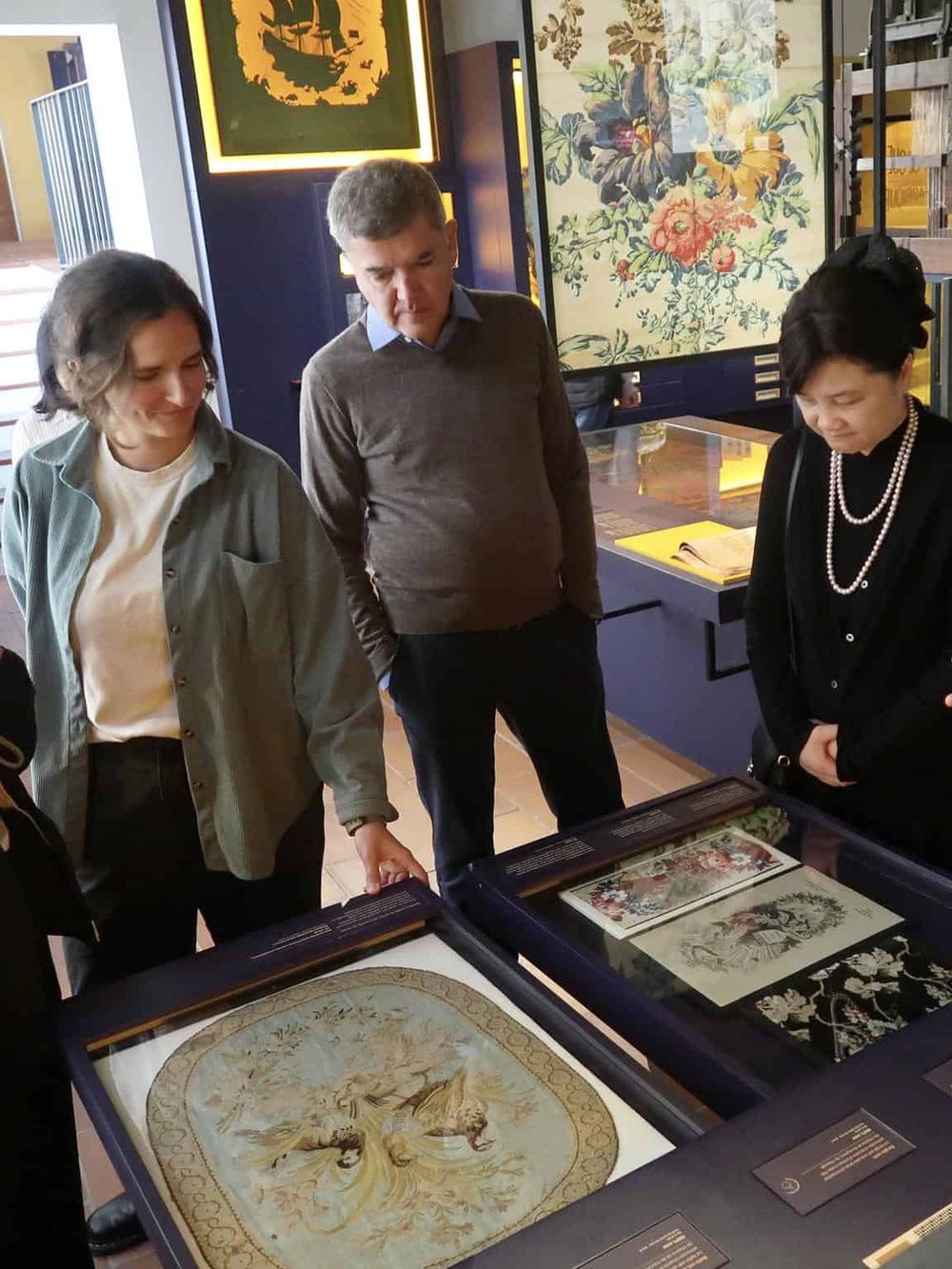 Intriguing art exhibition showcasing detailed vintage embroidery and textiles at QuestForDirections.