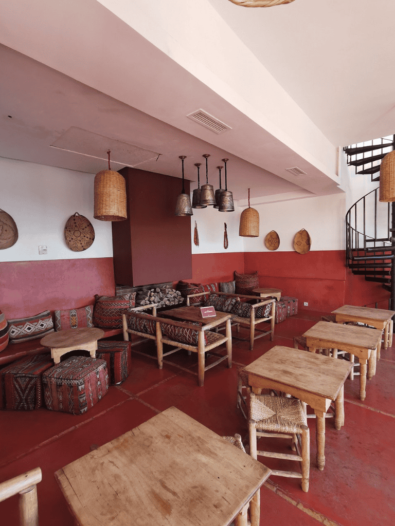 Cozy modern lounge with rustic furniture, warm lighting, and stylish decor, ideal for relaxing and socializing.