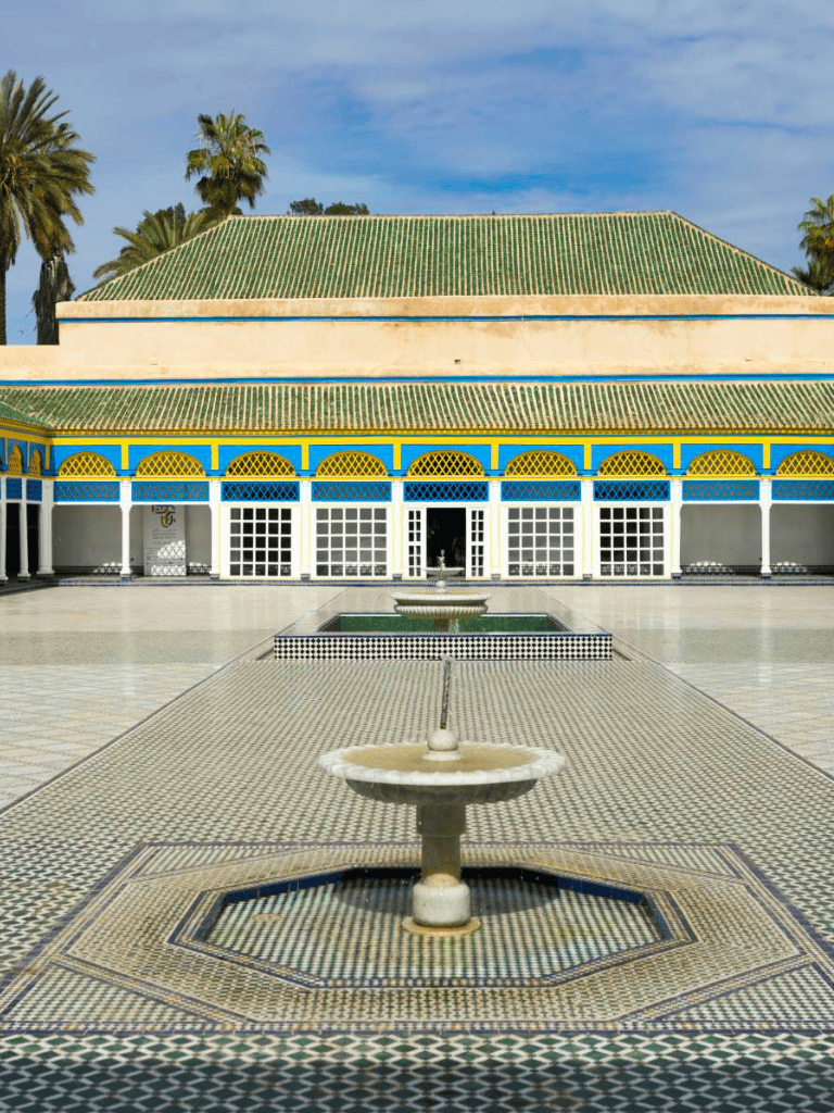 Elegant Moroccan architecture with colorful tiles and a central fountain, perfect for travelers seeking cultural destinations.