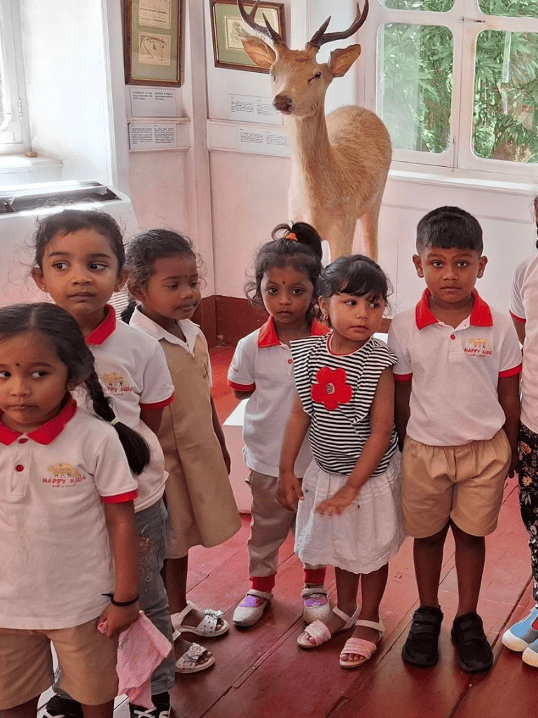 Adorable children visiting a wildlife museum, learning about deer and nature exhibits, educational trip for kids' curiosity and discovery.